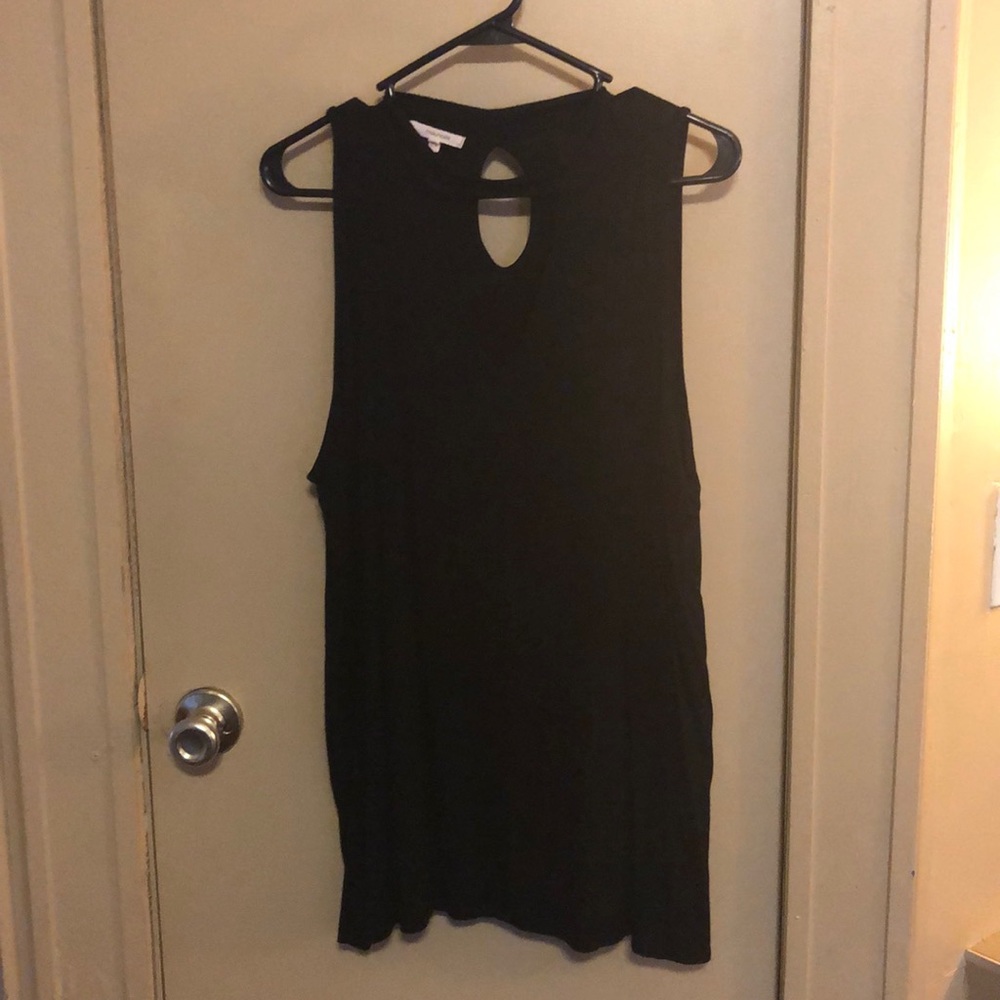 Black sleeveless top.